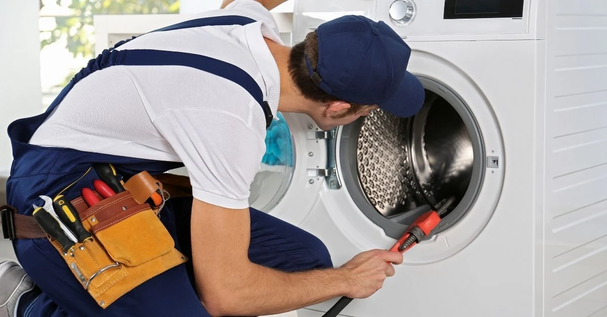 technician-repairing-washing-machine