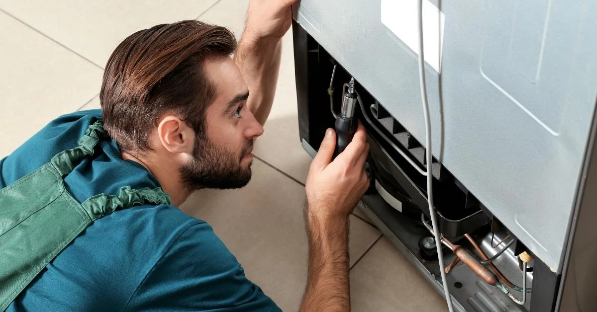 repairman-is-repairing-a-frdige-compressor