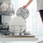 person-loading-dishwasher-in-destin