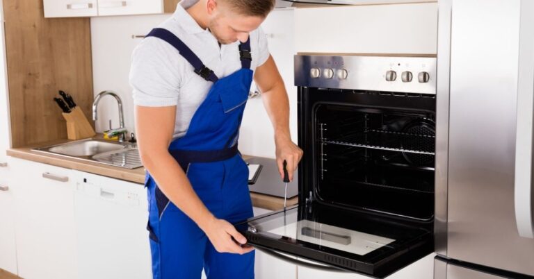a-repairman-is-repairing-an-oven