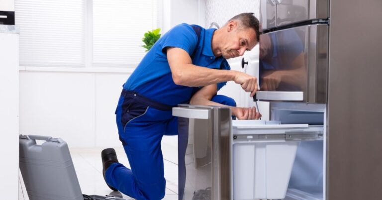 a-repairman-is-repairing-a-refrigerator