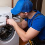 technician-working-on-washing-machine-beach-2-bay-appliances
