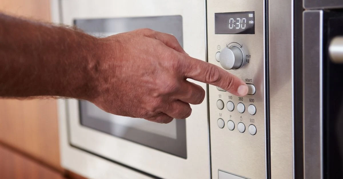 a-person-is-dialing-microwave-keypads